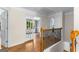 Upstairs hall features hardwood floors, decorative railing, and French doors to another room at 255 Hidden Lake Dr, Fayetteville, GA 30215