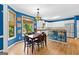 Charming kitchen with eat-in breakfast area and breakfast bar featuring hardwood floors and modern appliances at 255 Hidden Lake Dr, Fayetteville, GA 30215