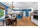 Kitchen features hardwood floors, barstool seating, stainless steel appliances and natural light at 255 Hidden Lake Dr, Fayetteville, GA 30215
