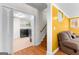 Spacious laundry room with modern washer and dryer units, offering convenient functionality adjacent to a cozy seating area at 255 Hidden Lake Dr, Fayetteville, GA 30215
