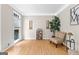 Inviting living room with hardwood floors, large windows, neutral walls and a comfortable sitting area at 255 Hidden Lake Dr, Fayetteville, GA 30215