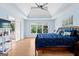 Main bedroom features a trey ceiling, hardwood floors, and plenty of natural light from multiple windows at 255 Hidden Lake Dr, Fayetteville, GA 30215