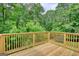 Back deck showing the backyard's trees and greenery at 1638 River Trc, Auburn, GA 30011
