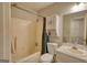This bathroom is equipped with a toilet, a bathtub and shower combination, and an integrated sink at 1638 River Trc, Auburn, GA 30011