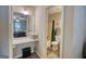 This small bathroom features a vanity area with a sink, mirror, and separate toilet and shower room at 1638 River Trc, Auburn, GA 30011