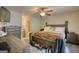 A comfortable bedroom with a ceiling fan, ensuite bathroom, and walk-in closet at 1638 River Trc, Auburn, GA 30011