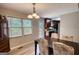 Dining room showcasing a modern table and chairs near a window, adjacent to a door that leads to a deck at 1638 River Trc, Auburn, GA 30011