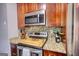 A kitchen featuring granite countertops, stainless steel appliances, and decorative backsplash at 1638 River Trc, Auburn, GA 30011