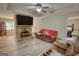 Cozy living room with stone fireplace, a flat screen television and comfortable seating, newly remodeled with modern floors at 1638 River Trc, Auburn, GA 30011