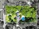 Aerial view of a property outlined within a forested area at 324 Chimney Sweep Cir, Peachtree City, GA 30269