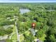 Aerial shot of a home near Lake Kedron surrounded by lush, green trees at 324 Chimney Sweep Cir, Peachtree City, GA 30269