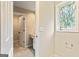 Bathroom with granite countertop, white cabinets, stylish window, and neutral walls at 324 Chimney Sweep Cir, Peachtree City, GA 30269