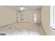 Bedroom with neutral walls, carpet, and trim, multiple closets, window with wooded yard view, and ceiling fan at 324 Chimney Sweep Cir, Peachtree City, GA 30269
