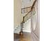 Inviting foyer with hardwood floors, staircase with iron railings, and a decorative front door at 324 Chimney Sweep Cir, Peachtree City, GA 30269