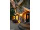 Exterior of a stone home with a covered front porch and manicured landscaping at 324 Chimney Sweep Cir, Peachtree City, GA 30269