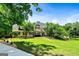 A stunning home with professional landscaping and a lush, green lawn at 324 Chimney Sweep Cir, Peachtree City, GA 30269
