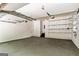 Spacious garage with ample storage shelving and painted walls at 324 Chimney Sweep Cir, Peachtree City, GA 30269