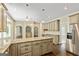 Open kitchen featuring granite countertops, stainless steel appliances, and hardwood flooring throughout at 324 Chimney Sweep Cir, Peachtree City, GA 30269