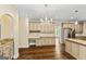 Spacious kitchen with granite countertops, tile backsplash, stainless steel appliances, and hardwood flooring throughout at 324 Chimney Sweep Cir, Peachtree City, GA 30269