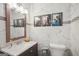 Elegant bathroom with marble tile, a framed mirror, and modern fixtures creating a luxurious space at 120 Bowfin Bay, Peachtree City, GA 30269