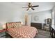 Inviting bedroom with wood-look flooring, a ceiling fan, and neutral walls, promoting a relaxing atmosphere at 120 Bowfin Bay, Peachtree City, GA 30269