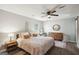 Serene bedroom with wood floors, a ceiling fan, and natural light creating a peaceful retreat at 120 Bowfin Bay, Peachtree City, GA 30269