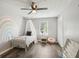 Bright bedroom features wood floors, rainbow mural, and a cozy canopy bed with natural light from the window at 120 Bowfin Bay, Peachtree City, GA 30269
