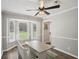 Bright dining area featuring a bay window and farmhouse-style dining set at 120 Bowfin Bay, Peachtree City, GA 30269