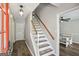 Inviting foyer with a staircase leading upstairs and views into the dining room at 120 Bowfin Bay, Peachtree City, GA 30269