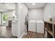 Convenient laundry room with washer, dryer, and storage space, located near the kitchen and living areas at 120 Bowfin Bay, Peachtree City, GA 30269