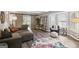 Relaxing living room area with sliding barn doors and large windows at 120 Bowfin Bay, Peachtree City, GA 30269