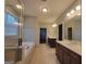 Primary bathroom featuring double sink vanity, soaking tub and separate shower at 1946 Jeffery Nw Rd, Atlanta, GA 30318