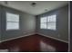 Bedroom featuring hardwood floors and windows with blinds at 1946 Jeffery Nw Rd, Atlanta, GA 30318