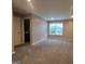 Large bedroom with neutral carpet, paint, and bright window with view of the outdoors at 1946 Jeffery Nw Rd, Atlanta, GA 30318