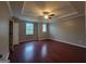 Spacious bedroom with hardwood floors, ceiling fan, and windows at 1946 Jeffery Nw Rd, Atlanta, GA 30318