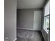 This bedroom boasts neutral walls, plush carpet, and a bright window for a cozy retreat at 1946 Jeffery Nw Rd, Atlanta, GA 30318