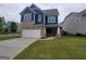 Lovely home with two-car garage, stone and blue siding, and a well-maintained lawn; perfect for Gathering living at 1946 Jeffery Nw Rd, Atlanta, GA 30318