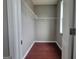 Walk-in closet features ample shelving and hardwood floors for convenient storage at 1946 Jeffery Nw Rd, Atlanta, GA 30318
