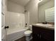 Bathroom features a vanity, toilet, shower, and tub at 6703 Biscayne Blvd, Rex, GA 30273