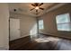 Spacious bedroom with trey ceiling, ceiling fan and hardwood floors at 6703 Biscayne Blvd, Rex, GA 30273