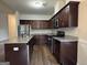 Well-appointed kitchen featuring stainless steel appliances, granite countertops, and plenty of cabinet space at 6703 Biscayne Blvd, Rex, GA 30273