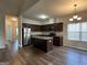 Open concept kitchen with a center island and stainless steel appliances at 6703 Biscayne Blvd, Rex, GA 30273