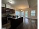 Modern kitchen featuring an island, stainless steel appliances, and natural light at 6703 Biscayne Blvd, Rex, GA 30273