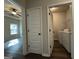 View of bedroom door, closet door, and laundry room at 6703 Biscayne Blvd, Rex, GA 30273