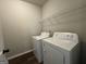 Laundry room featuring a new washer and dryer at 6703 Biscayne Blvd, Rex, GA 30273