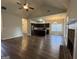 Open concept living room featuring a fireplace and hardwood floors at 6703 Biscayne Blvd, Rex, GA 30273
