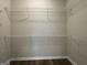Spacious walk-in closet featuring custom wire shelving for ample storage and organization in the home at 6703 Biscayne Blvd, Rex, GA 30273