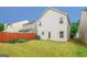 Backyard featuring a lawn, privacy fence, and lush greenery providing shade at 1562 Onalee Dr, Hampton, GA 30228