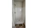 Step-in shower featuring solid surface walls and a simple showerhead at 1562 Onalee Dr, Hampton, GA 30228