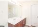 Bathroom with double sink vanity, large mirror, and tile floors at 1562 Onalee Dr, Hampton, GA 30228